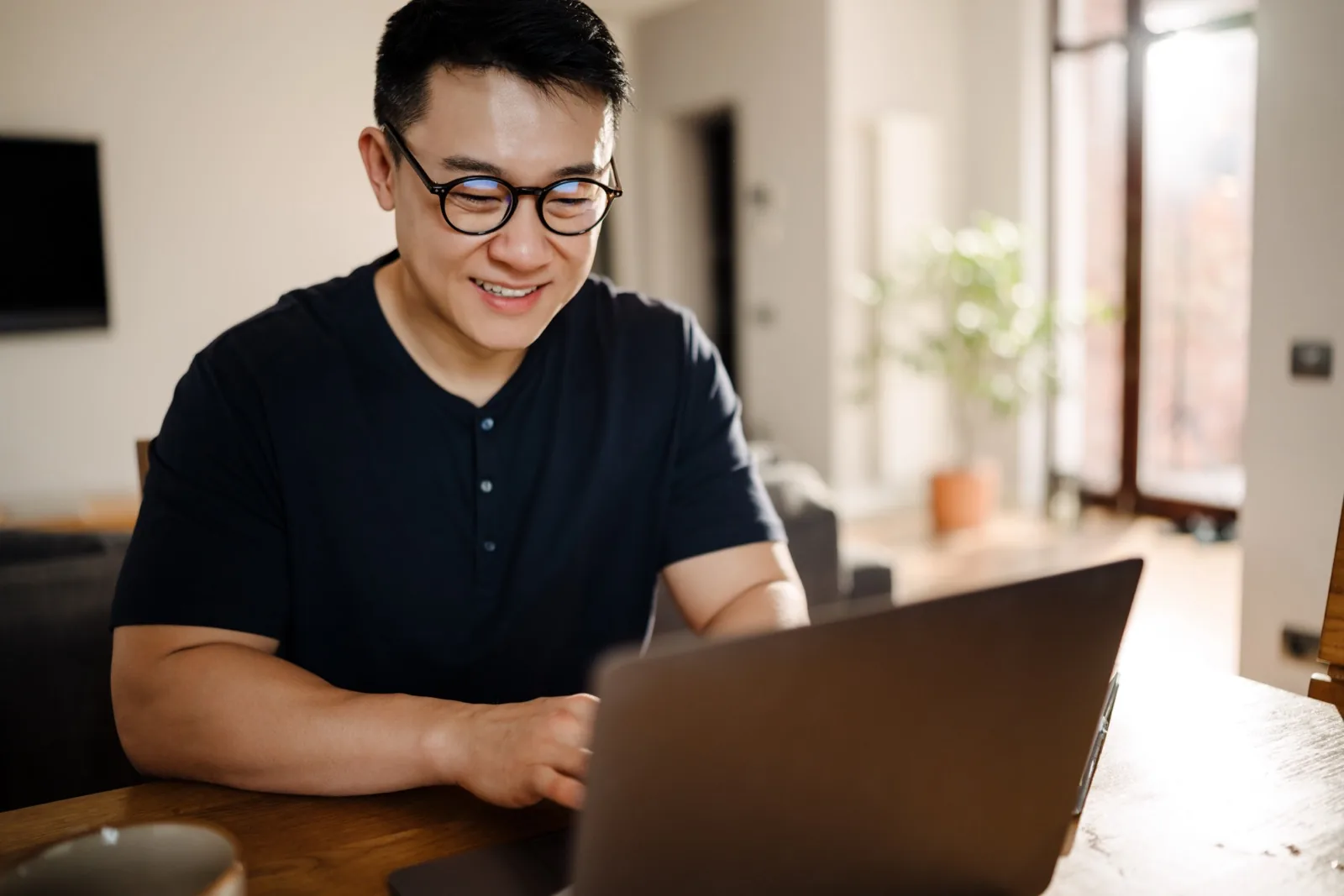 Mortgage broker working at laptop